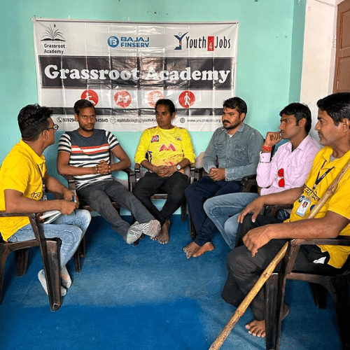 Grassroot Academy - Persons with disabilities sitting and discussing