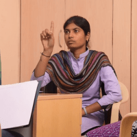 WEDO: Women Entrepreneurs with Disabilities - A girl sitting confidently in an office environment, representing empowerment and inclusivity in entrepreneurship for women with disabilities.