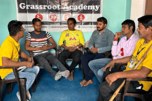 Grassroot Academy - Persons with disabilities sitting and discussing