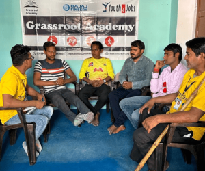 Grassroot Academy - Persons with disabilities sitting and discussing
