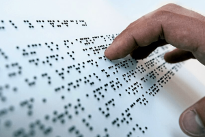 A blind person using brail