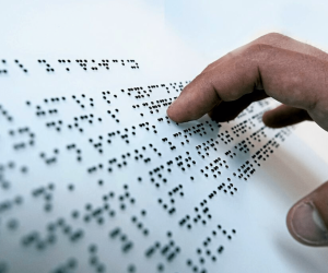 A blind person using brail