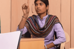 WEDO: Women Entrepreneurs with Disabilities - A girl sitting confidently in an office environment, representing empowerment and inclusivity in entrepreneurship for women with disabilities.